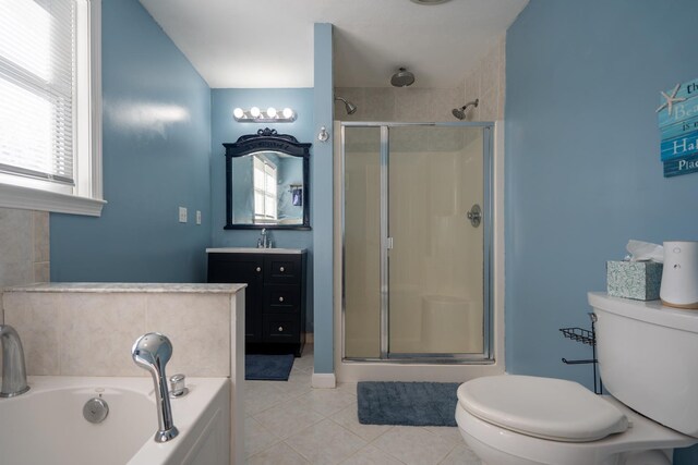 bathroom featuring toilet, a stall shower, and tile patterned floors