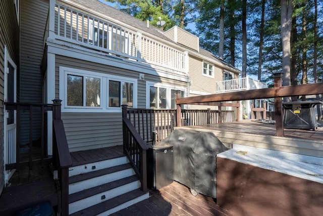 wooden terrace featuring grilling area