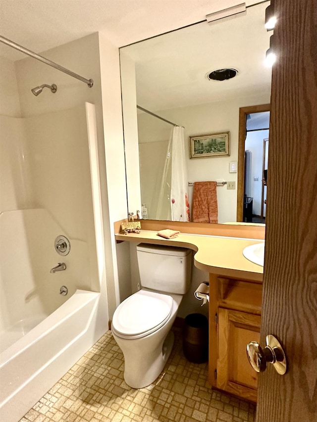 full bath featuring shower / tub combo, vanity, and toilet