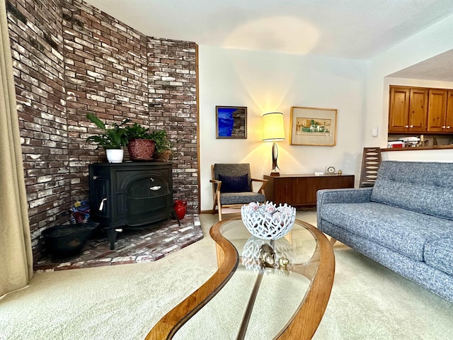 living area with carpet floors and a wood stove