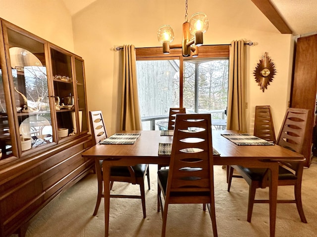 dining area with carpet floors, vaulted ceiling, and a notable chandelier