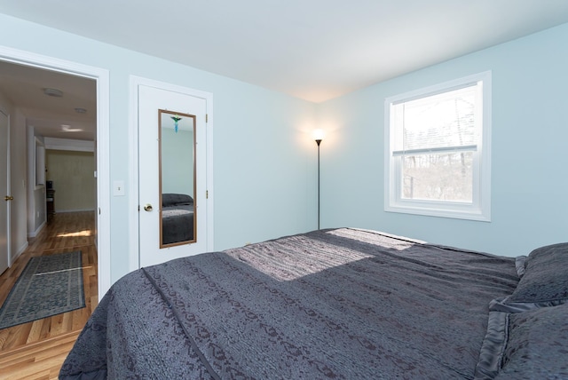 bedroom featuring wood finished floors