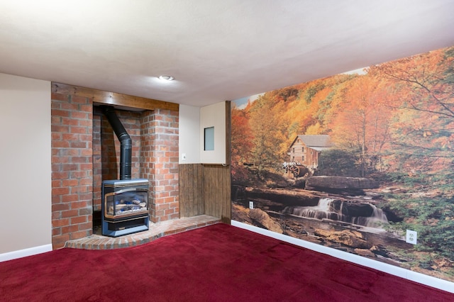 living room featuring a wood stove, carpet, and wainscoting