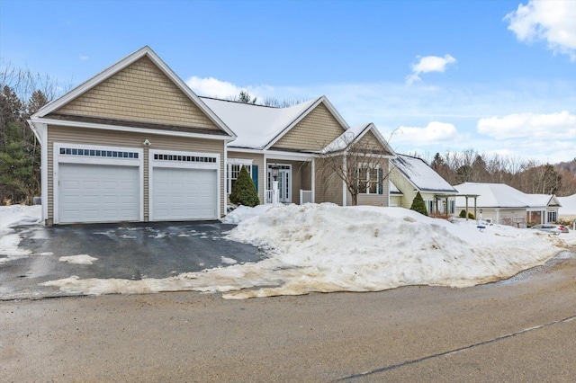 view of front of home with a garage and driveway