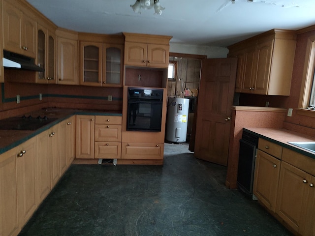 kitchen featuring dark floors, glass insert cabinets, electric water heater, under cabinet range hood, and black appliances