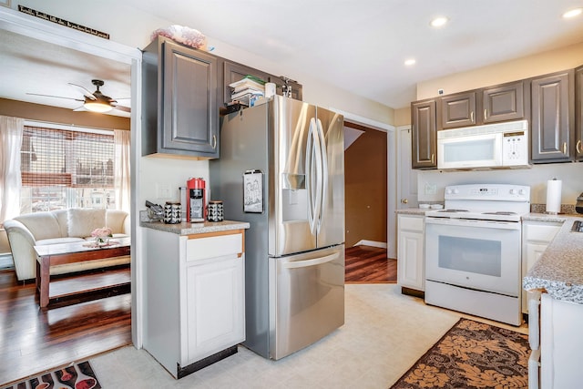 kitchen with a ceiling fan, recessed lighting, and white appliances