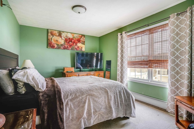 bedroom featuring a baseboard radiator and carpet flooring