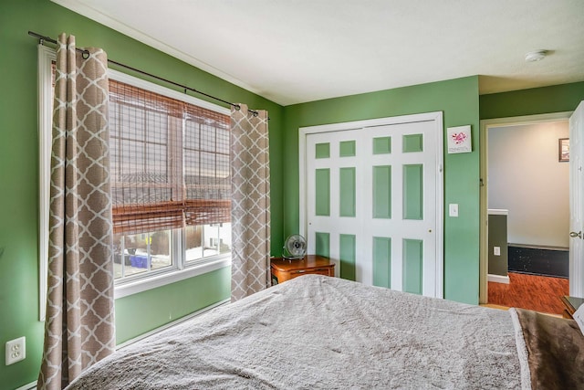 unfurnished bedroom featuring a closet and wood finished floors