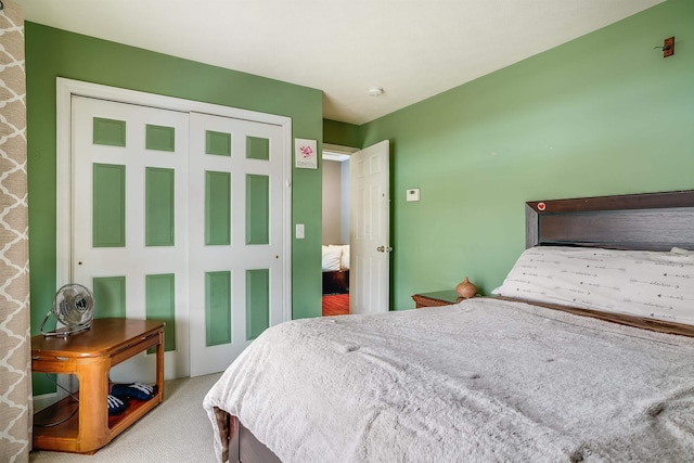 bedroom with a closet and carpet flooring