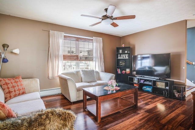 living area featuring ceiling fan, baseboards, baseboard heating, and wood finished floors