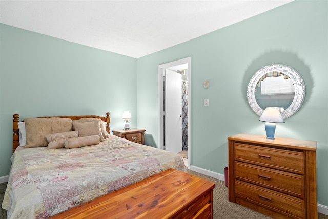 carpeted bedroom featuring baseboards