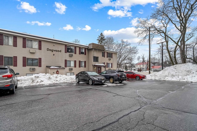 uncovered parking lot with a residential view