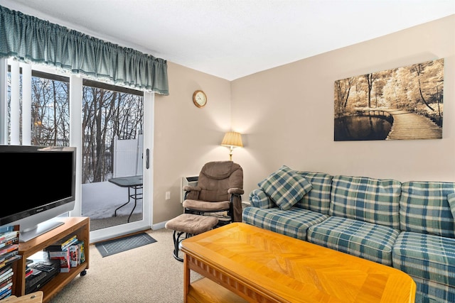 living room with carpet flooring and baseboards