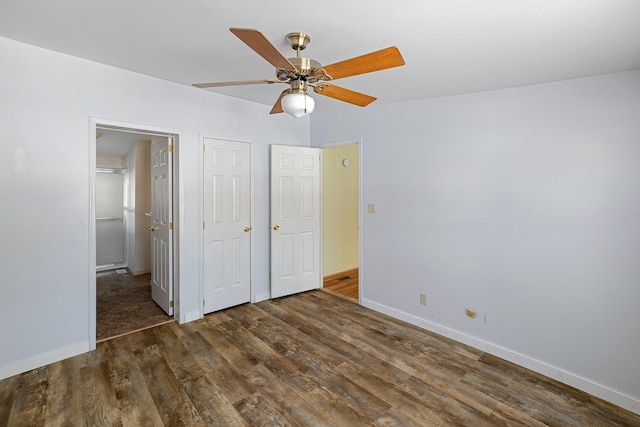 unfurnished bedroom featuring ceiling fan, wood finished floors, and baseboards