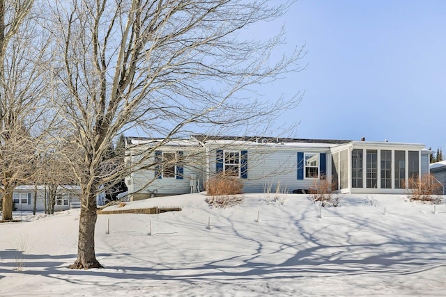 view of front of home featuring a sunroom