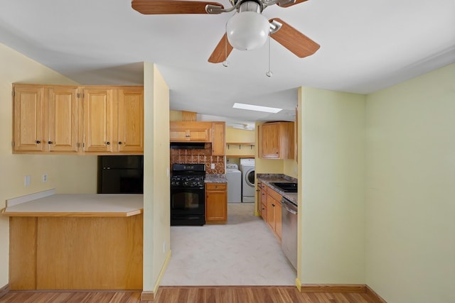 kitchen with black range with gas cooktop, washer / clothes dryer, stainless steel dishwasher, and refrigerator