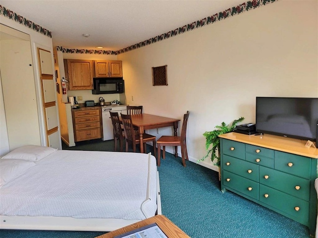 bedroom featuring dark colored carpet and baseboards