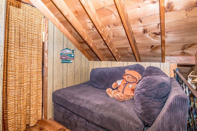 bedroom with wood walls and lofted ceiling