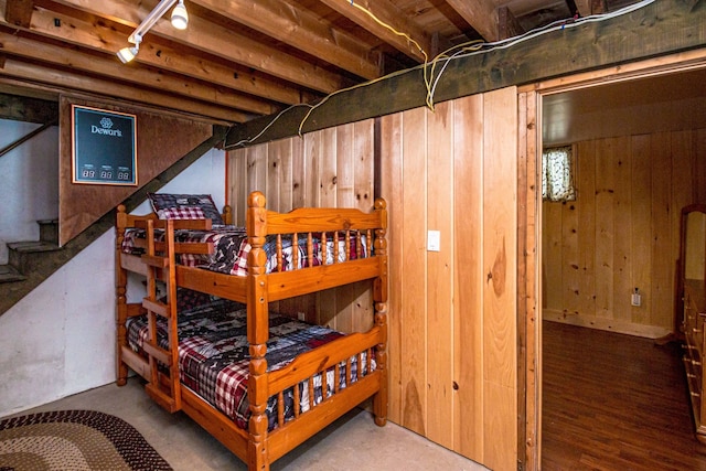 bedroom with wooden walls