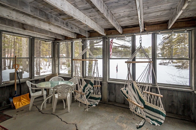 unfurnished sunroom featuring a wealth of natural light