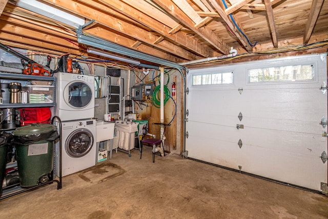 garage with stacked washer / dryer