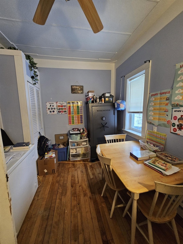 dining room with ceiling fan and hardwood / wood-style flooring