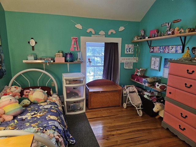 bedroom with lofted ceiling and hardwood / wood-style flooring