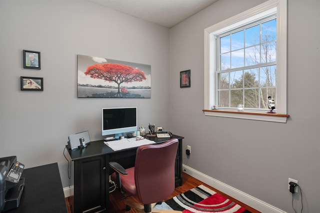 office space featuring wood finished floors and baseboards