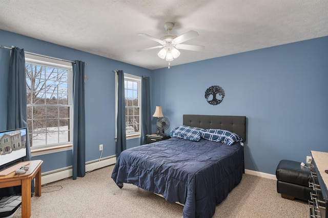 bedroom with ceiling fan, carpet, baseboards, and baseboard heating