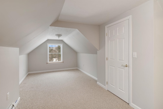 additional living space with carpet, vaulted ceiling, and baseboards