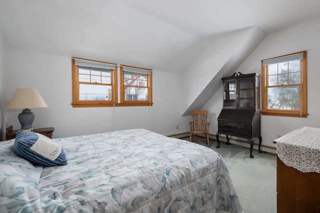 carpeted bedroom featuring lofted ceiling and baseboard heating