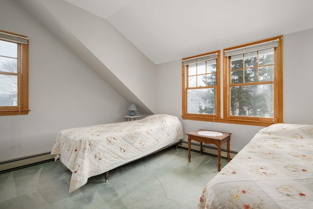 bedroom featuring vaulted ceiling, a baseboard radiator, and carpet