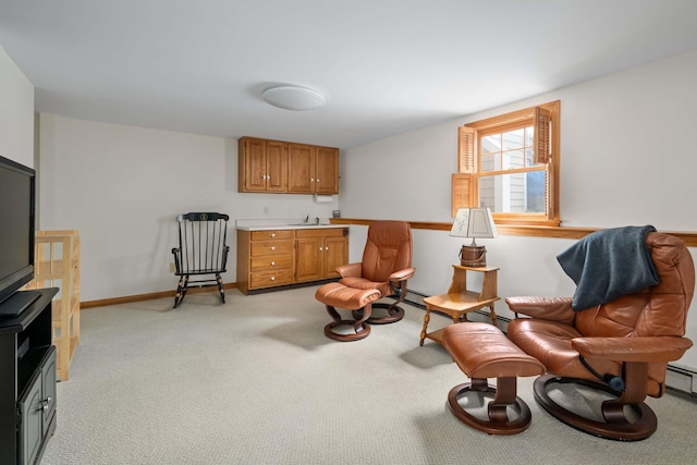 sitting room with light carpet and baseboards