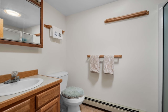 full bath featuring a baseboard heating unit, a shower with door, vanity, and toilet