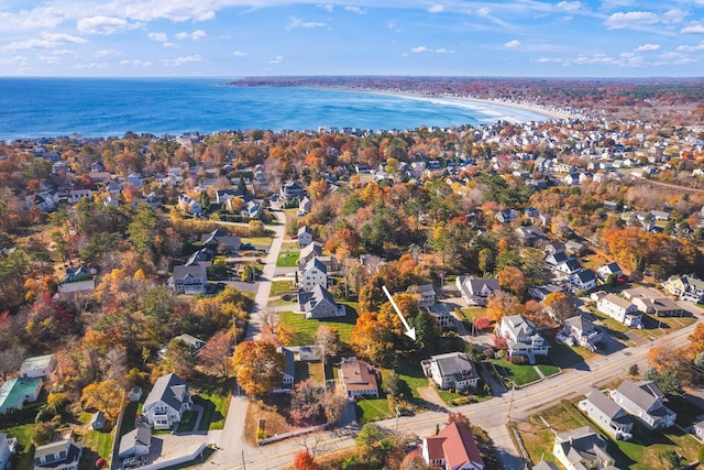 drone / aerial view with a water view and a residential view