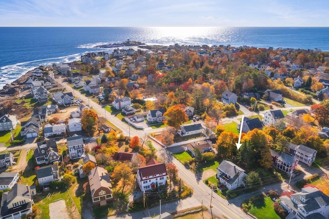 drone / aerial view featuring a water view and a residential view