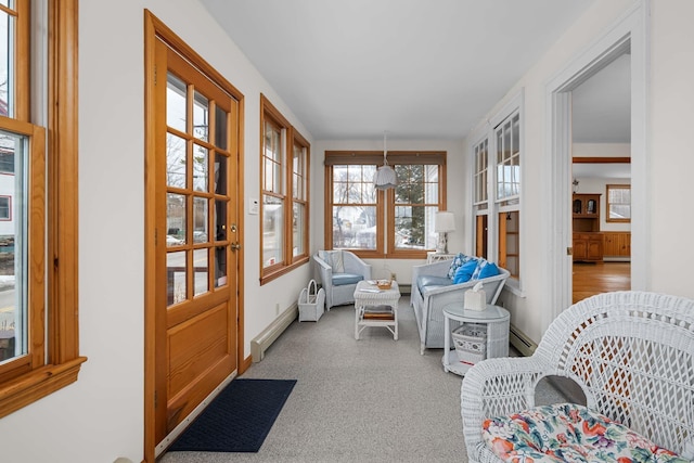 sunroom / solarium featuring a baseboard heating unit and baseboard heating