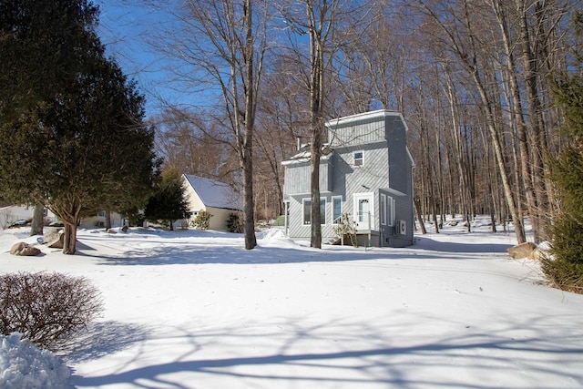 view of yard layered in snow