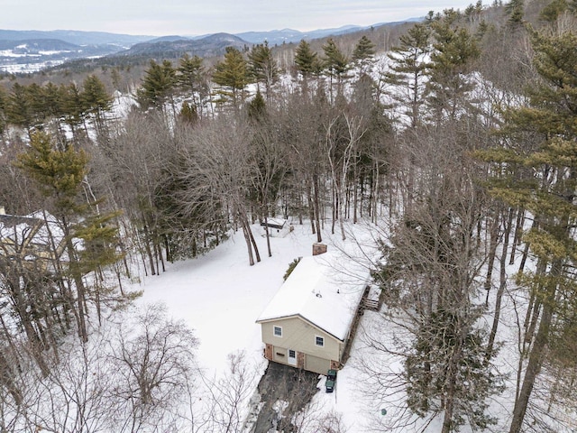 snowy aerial view featuring a mountain view