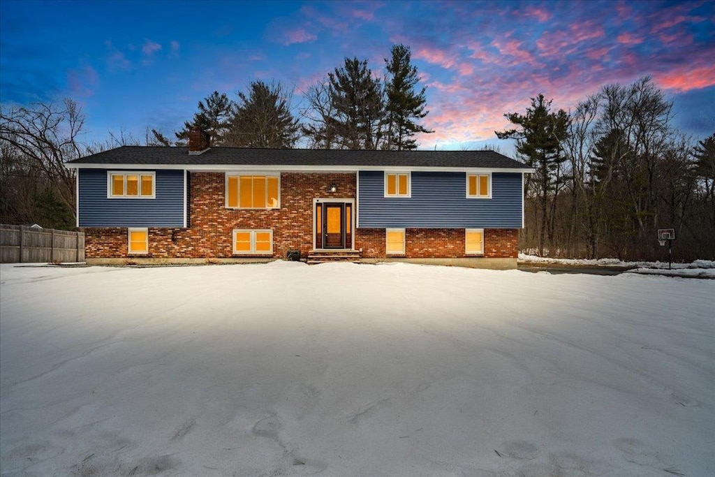 split foyer home with brick siding