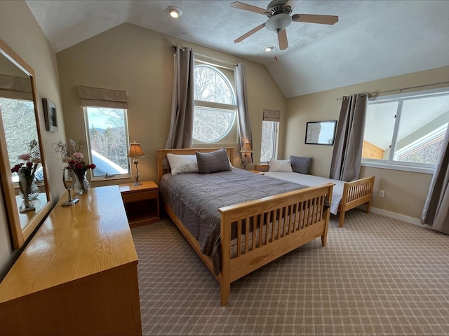 bedroom with carpet, ceiling fan, lofted ceiling, and baseboards