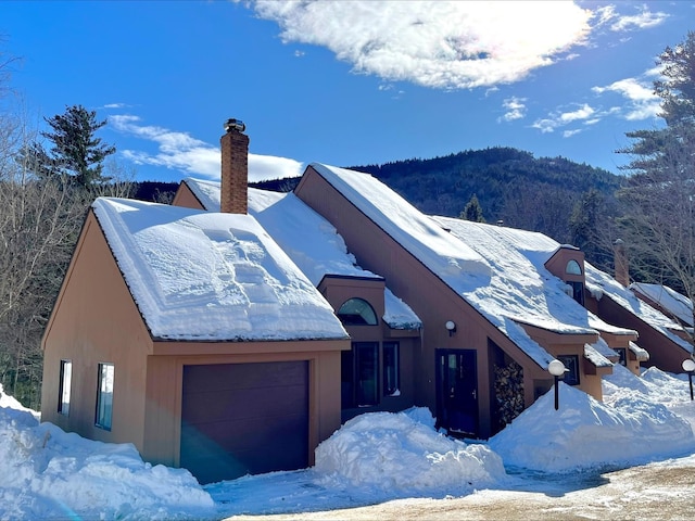 view of front of home featuring a chimney