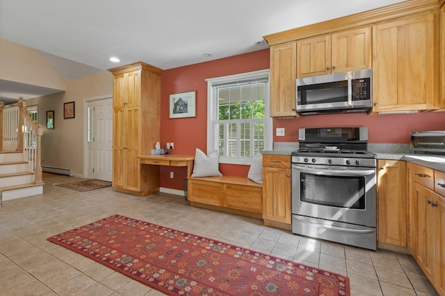 kitchen with stainless steel appliances, recessed lighting, a baseboard heating unit, built in study area, and light tile patterned flooring