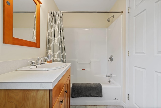 bathroom with shower / bath combo, tile patterned flooring, and vanity