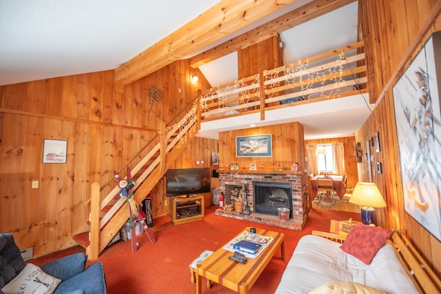 carpeted living room with wood walls, a fireplace, a high ceiling, and beam ceiling