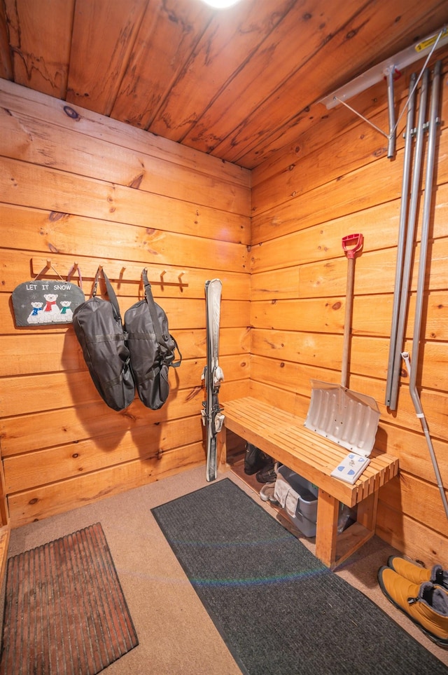 mudroom with wooden ceiling, carpet flooring, wood walls, and a sauna