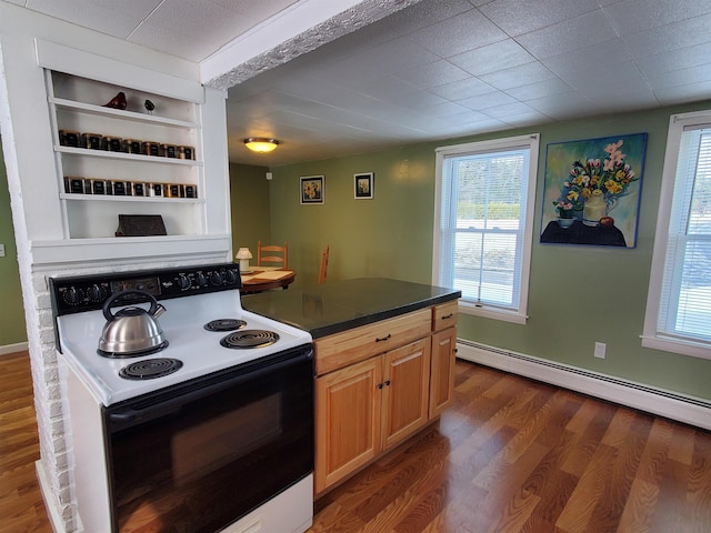 kitchen featuring built in shelves, dark wood finished floors, dark countertops, baseboard heating, and range with electric cooktop