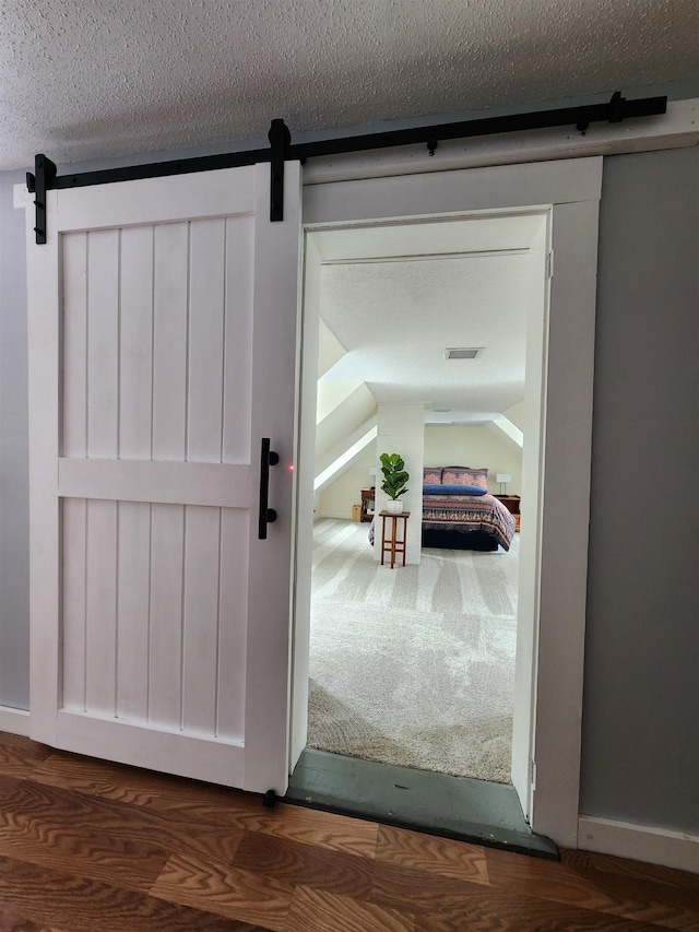 interior space featuring a barn door and visible vents