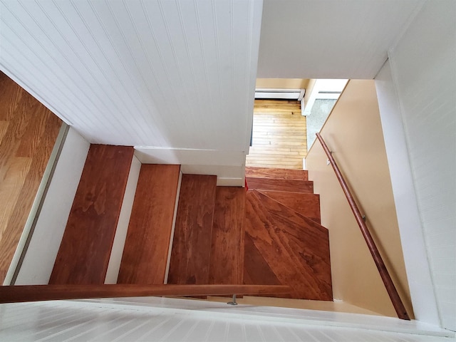 staircase with a baseboard radiator