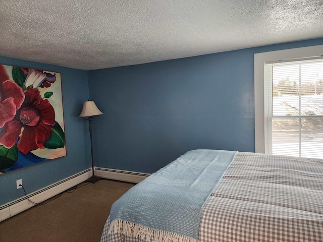 bedroom with a textured ceiling, carpet floors, and a baseboard radiator